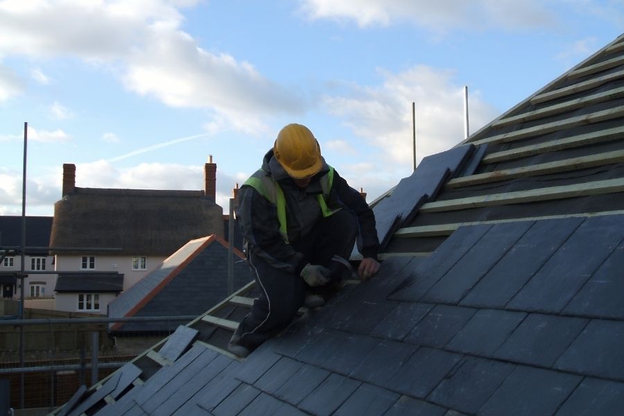 roofer installing a slate roof